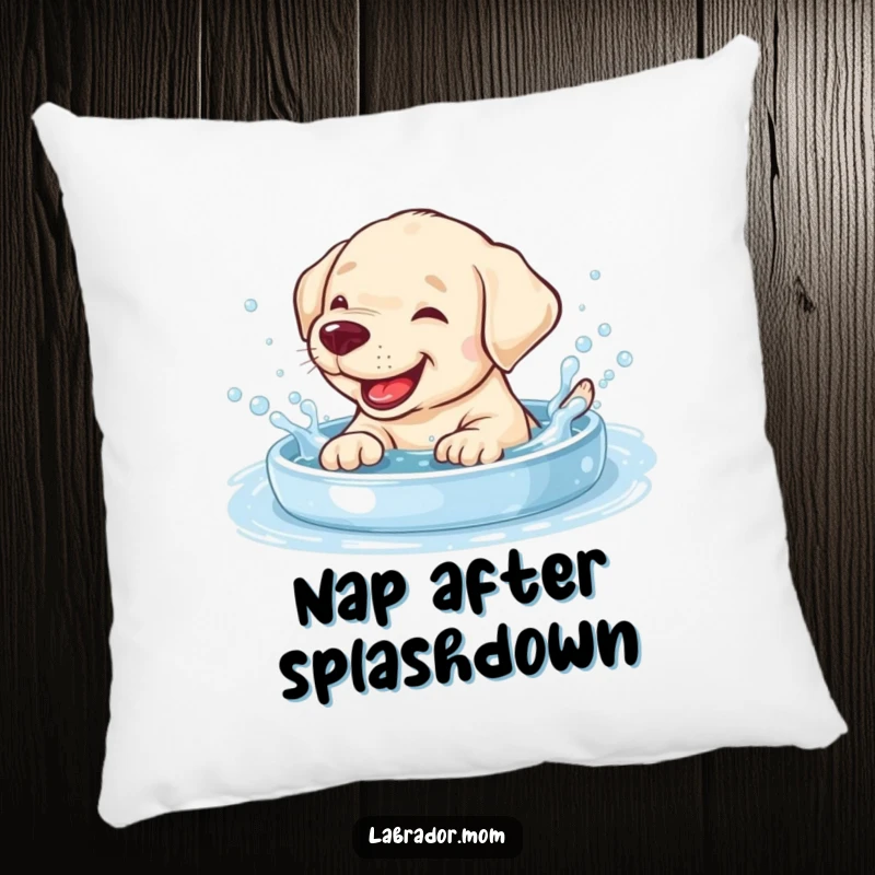 Funny giggling Labrador cub splashing in a bubbly pool on a soft, decorative pillow.