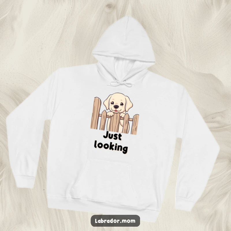 Funny kawaii Labrador peeking over a fence with its head tilted in friendly curiosity, a soft and cozy humorous hoodie.