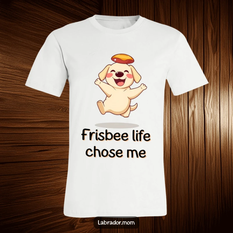 Funny T-Shirt depicting a grinning Labrador character soaring to catch a frisbee mid-air, full of athletic glee.