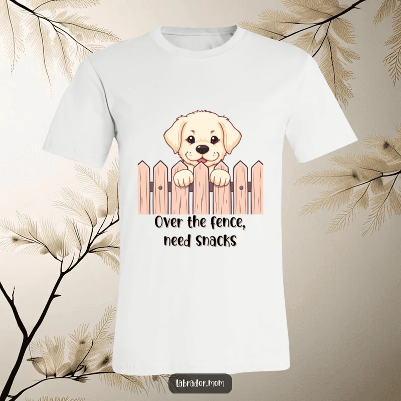 Funny Labrador pup peeking over a fence with an eager expression on a soft t-shirt, ideal for dog lovers and gift-givers.